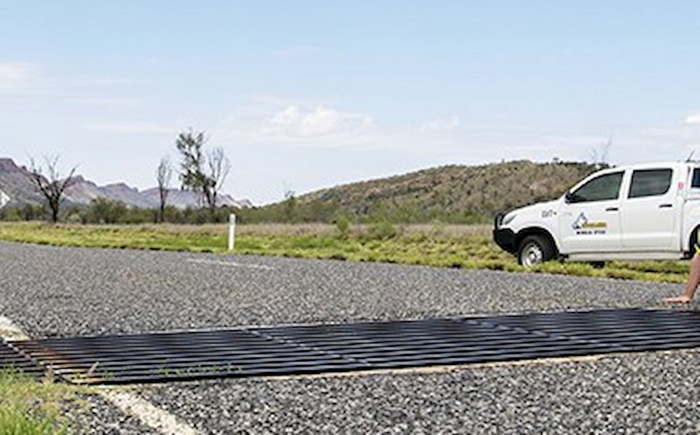 A White Car on the Side of a Road — Diggamen Civil Contracting in Tivendale, NT