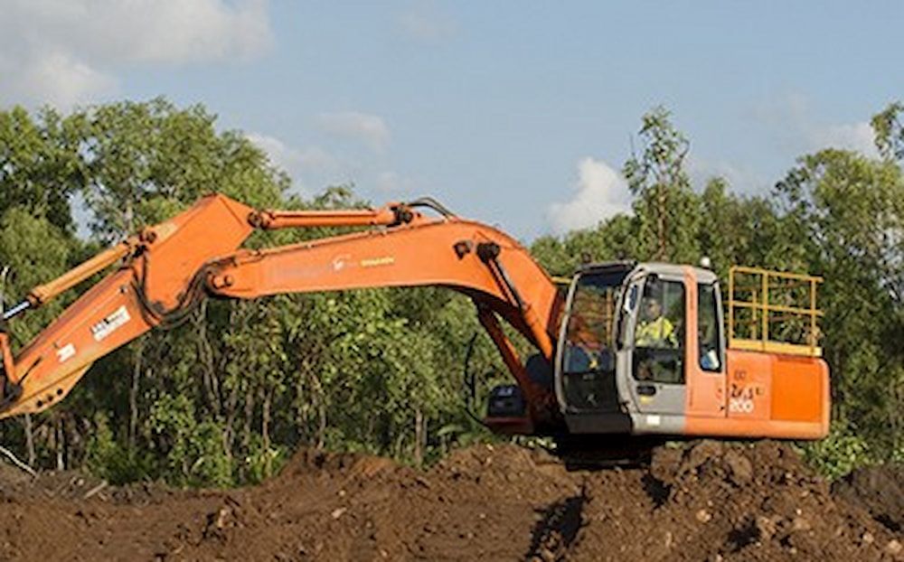 A Construction Site With a Yellow Excavator and a Red Excavator — Diggamen Civil Contracting in Tivendale, NT