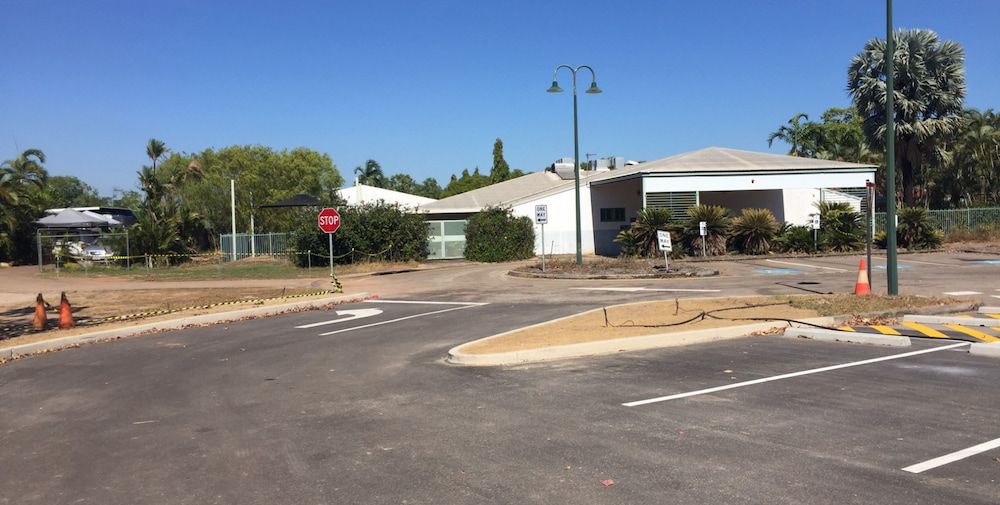 A Road With a Stop Sign in the Middle of It  — Diggamen Civil Contracting in Tivendale, NT