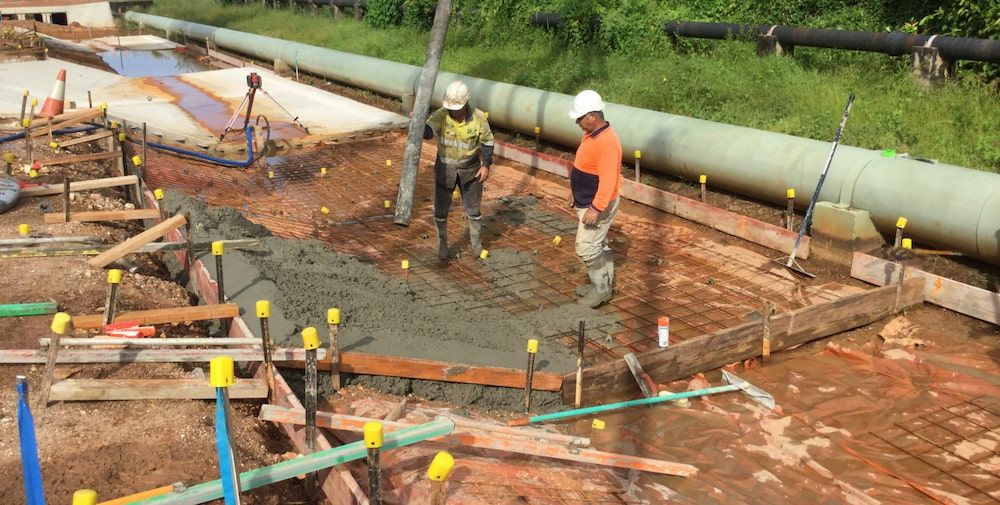 A Group of Construction Workers Are Working on A Construction Site — Diggamen Civil Contracting in Tivendale, NT