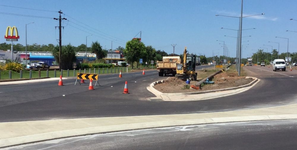 A Mcdonald 's is in the Background of a Construction Site — Diggamen Civil Contracting in Tivendale, NT