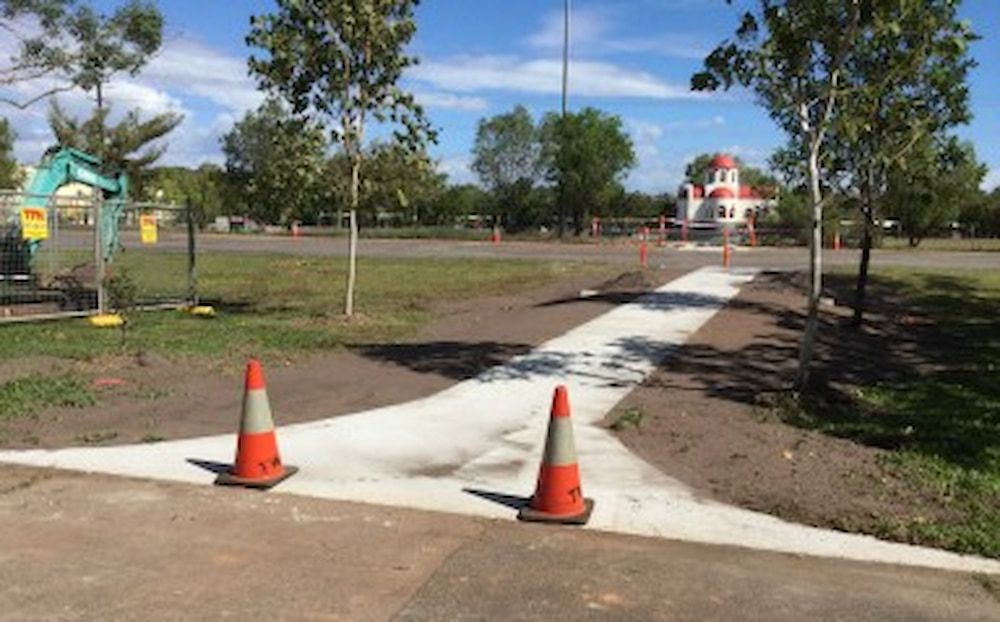 An Orange and White Traffic Cones on the Side of a Road — Diggamen Civil Contracting in Tivendale, NT