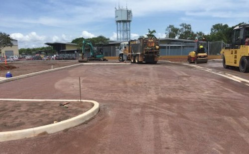 A Group of Construction Vehicles Are Working on a Road — Diggamen Civil Contracting in Tivendale, NT