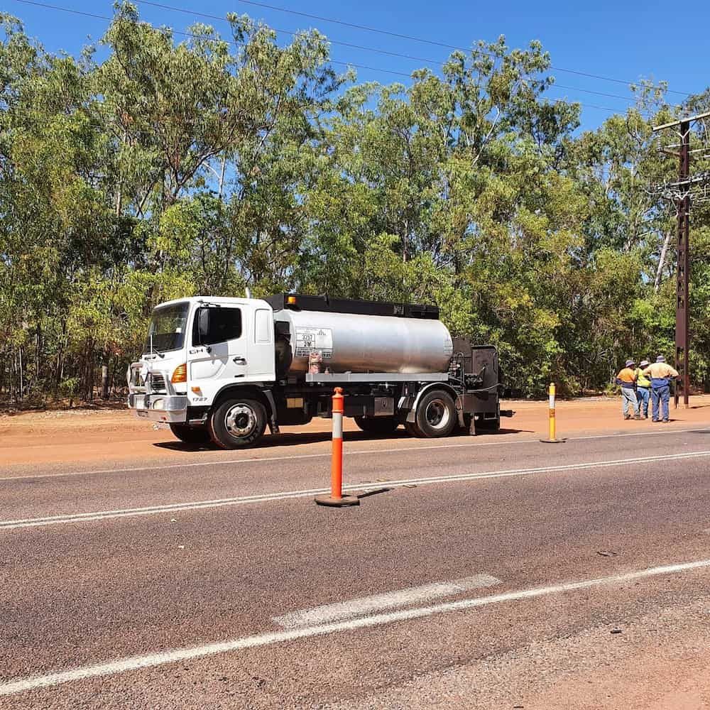 A Tanker Truck Is Parked on The Side of The Road — Diggamen Civil Contracting in Tivendale, NT