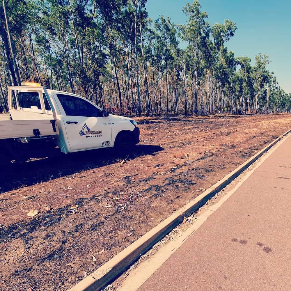 A White Truck Is Parked on The Side of The Road — Diggamen Civil Contracting in Tivendale, NT