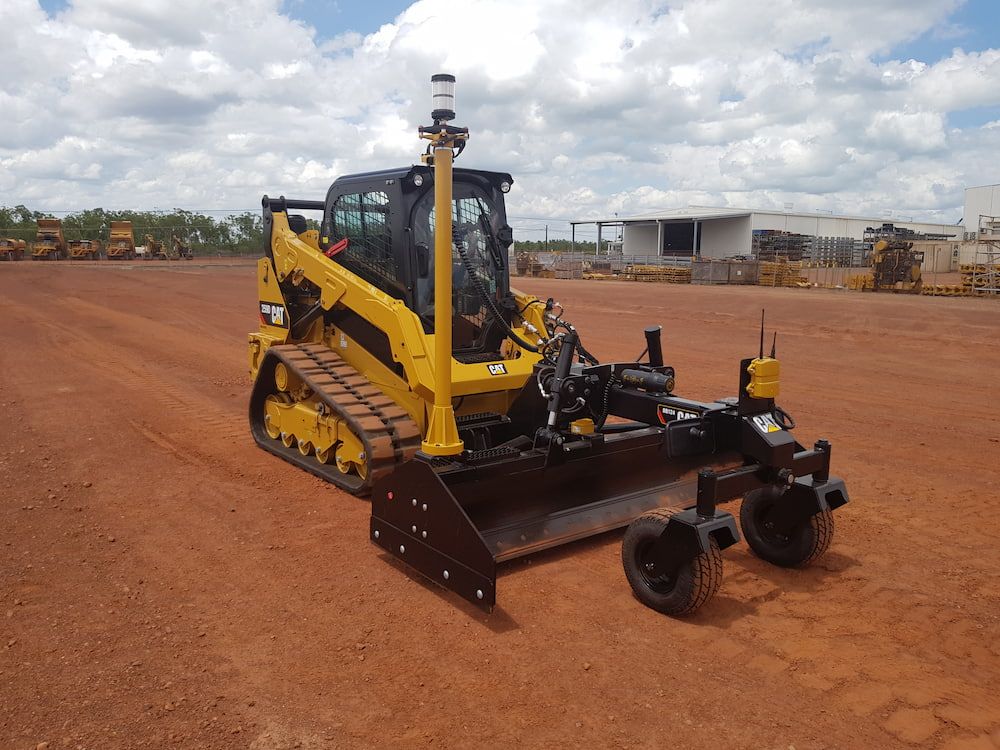 A Yellow Bulldozer Is Parked in A Dirt Field — Diggamen Civil Contracting in Tivendale, NT