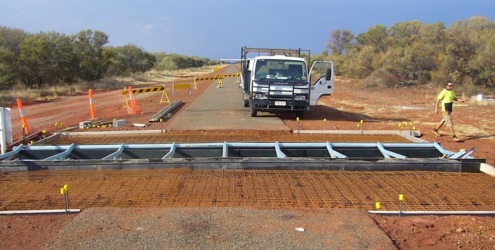 A White Truck is Parked on the Side of a Dirt Road — Diggamen Civil Contracting in Tivendale, NT