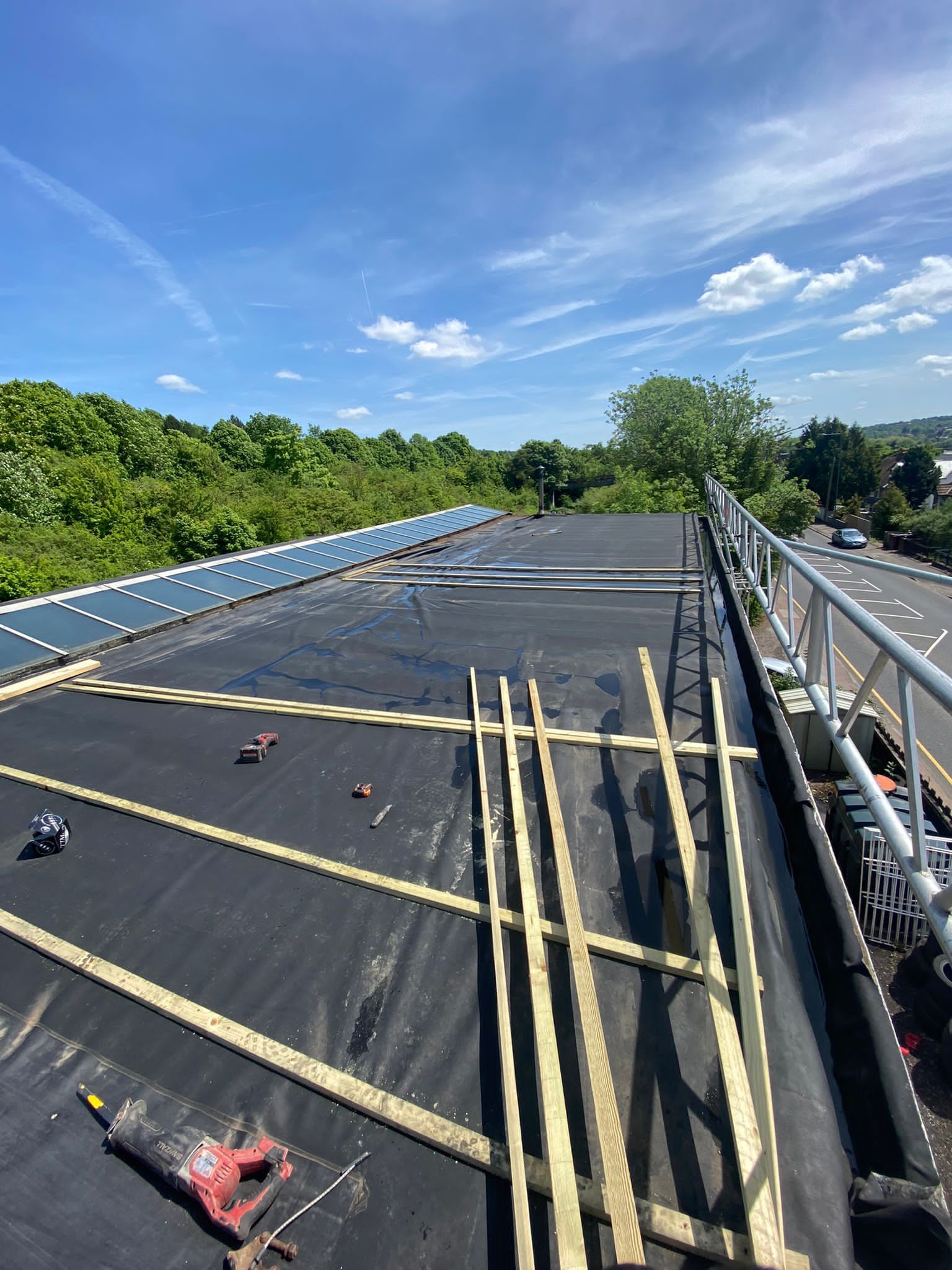 The roof of a building is being built with wooden beams.