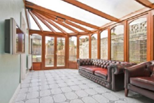A living room with a couch and chairs in it