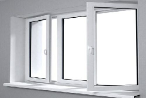 A white window is open in a room with a gray wall.