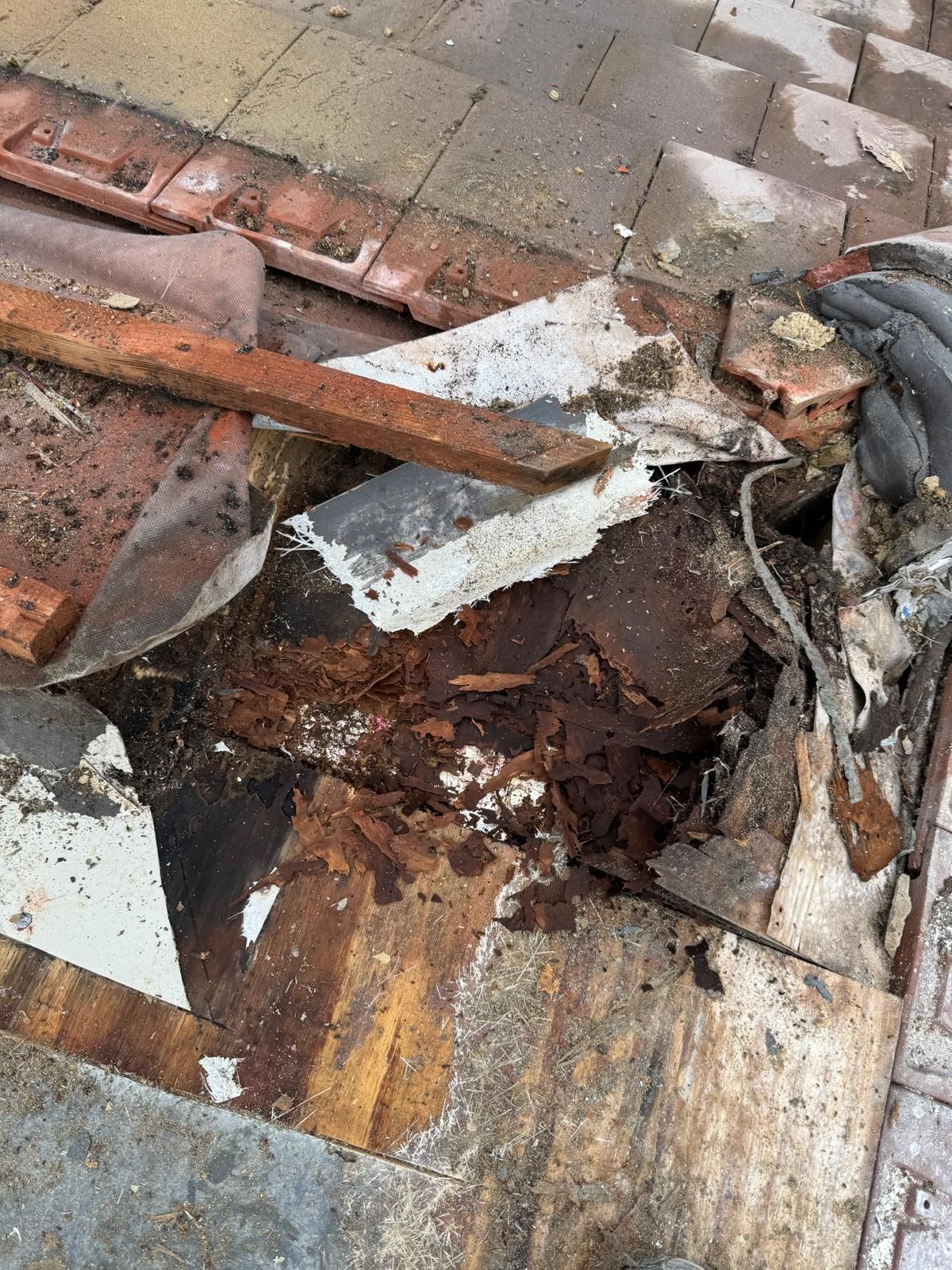 A pile of damaged roof tiles