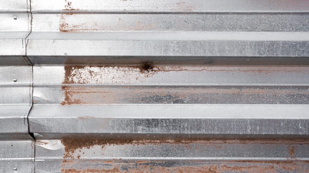 A close up of a rusty metal roof.