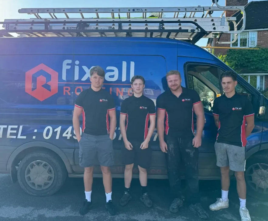 Fix All Roofing team of four contractors in company shirts standing by their van with a ladder in High Wycombe, ready for work.