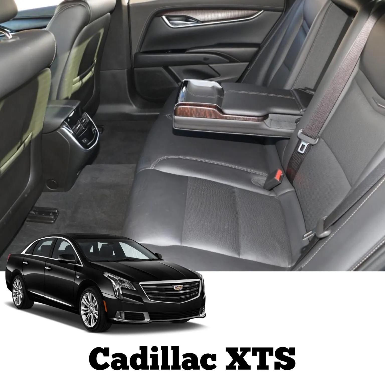 Black Cadillac XTS interior, leather seats, armrest folded down, and front of the car in bottom left.