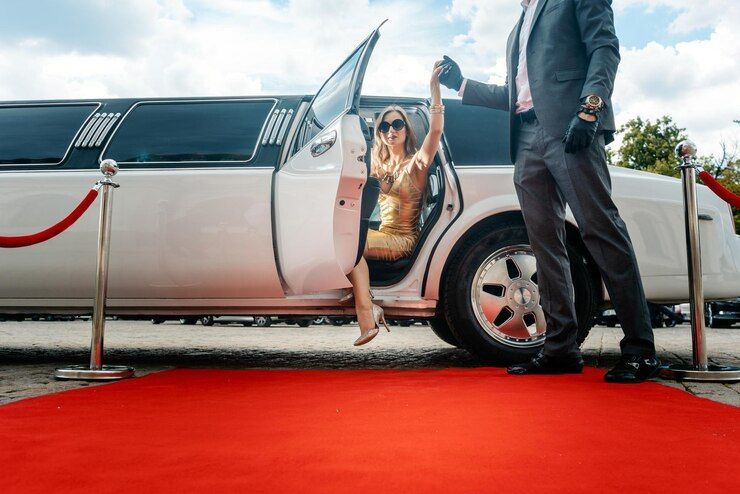 A group of people are sitting in a limousine.
