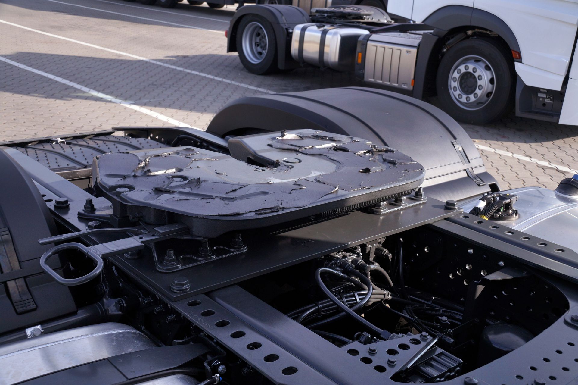 A semi truck is parked in a parking lot.