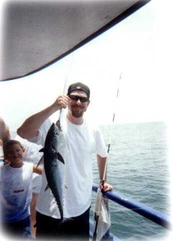 White man Holding Fish — Fort Myers, FL — Captain Tony’s Fishing Adventures