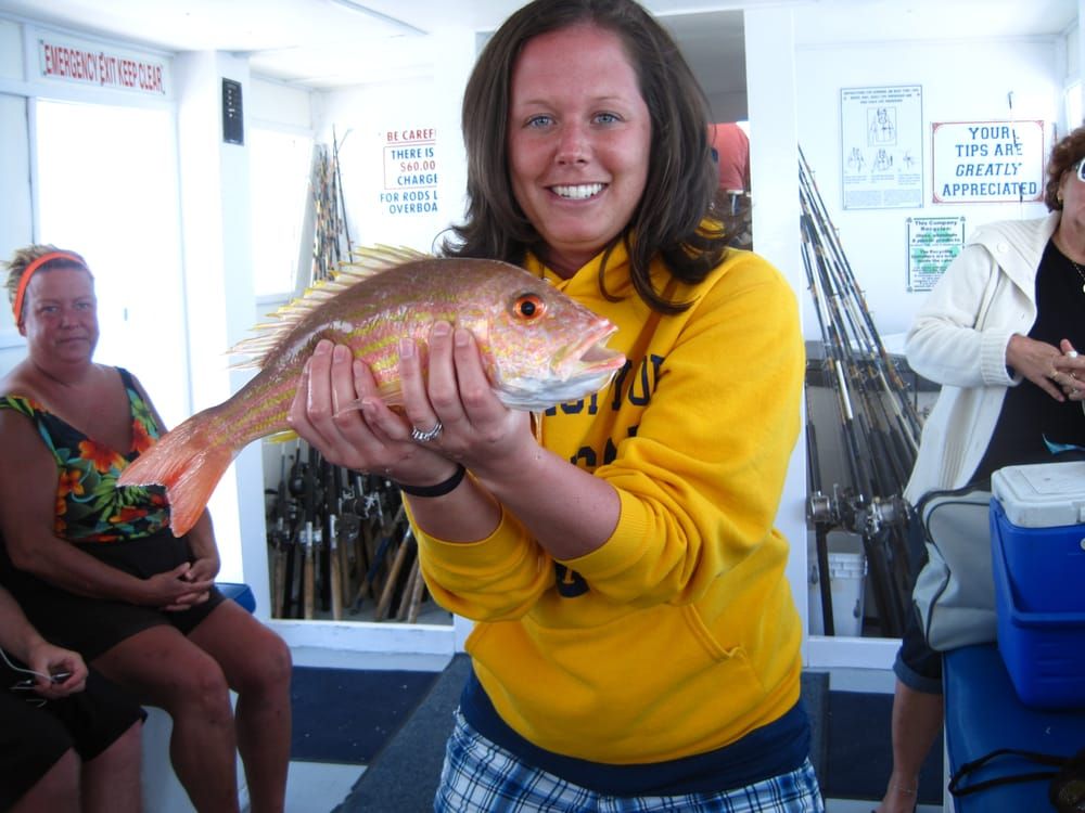 Woman in Yellow Shirt — Fort Myers, FL — Captain Tony’s Fishing Adventures