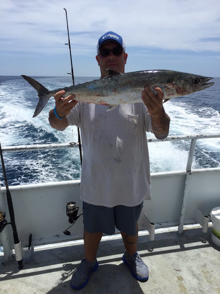 Man in White Shirt with Big Fish — Fort Myers, FL — Captain Tony’s Fishing Adventures