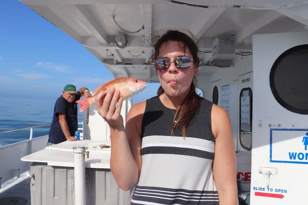 Woman Imitating Fish — Fort Myers, FL — Captain Tony’s Fishing Adventures