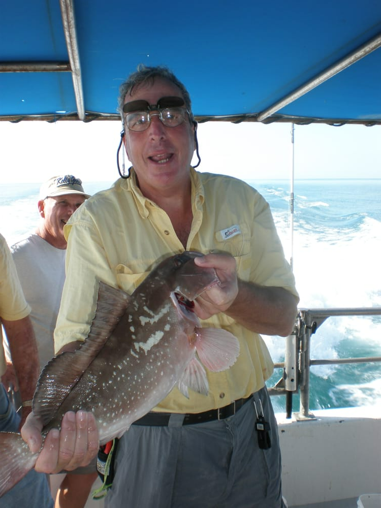 Man in Yellow Shirt — Fort Myers, FL — Captain Tony’s Fishing Adventures
