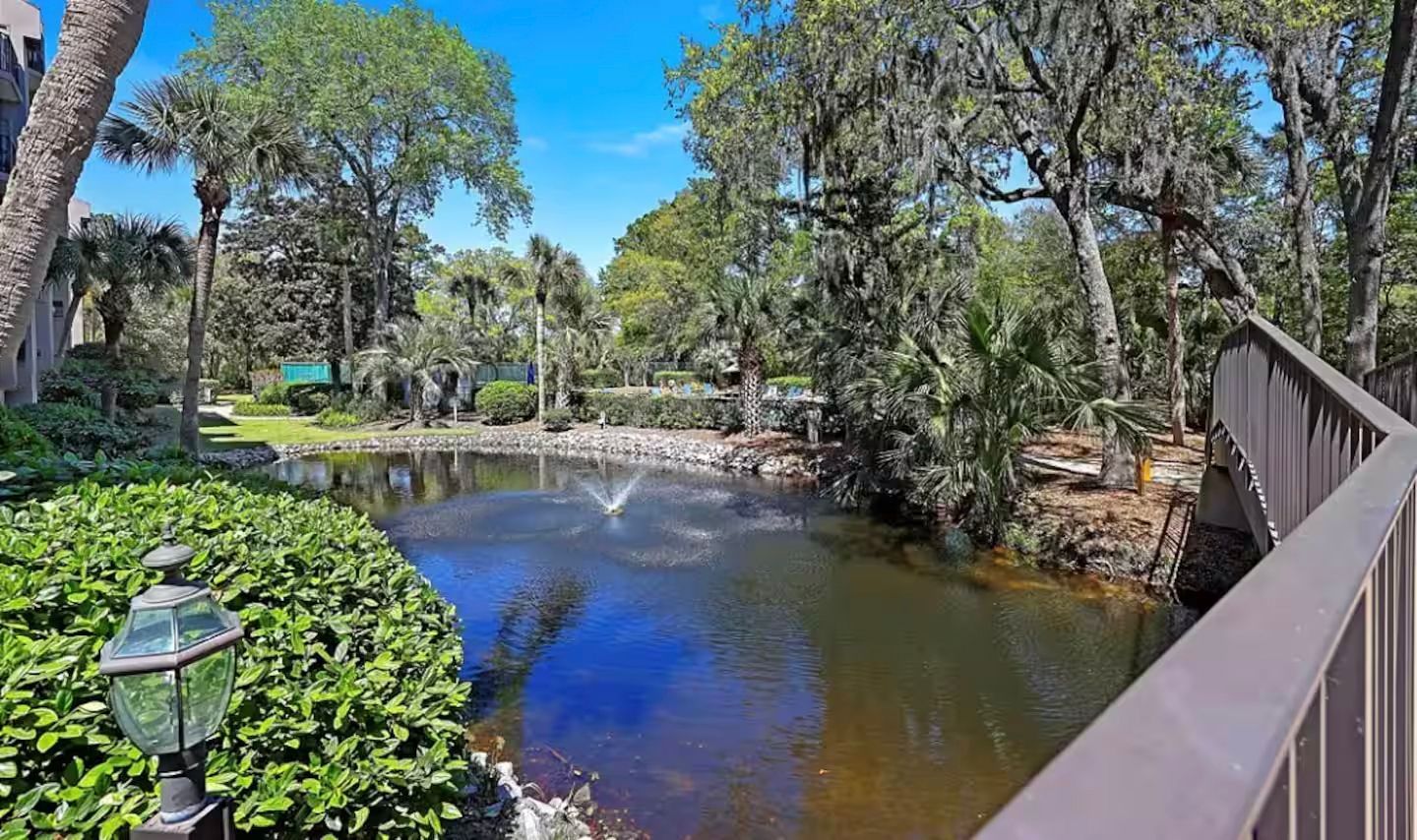 Beautiful landscaping and a pond are on your vacation property grounds.