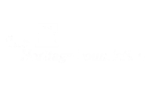 Mostly white blank image with faint gray marks near the center.