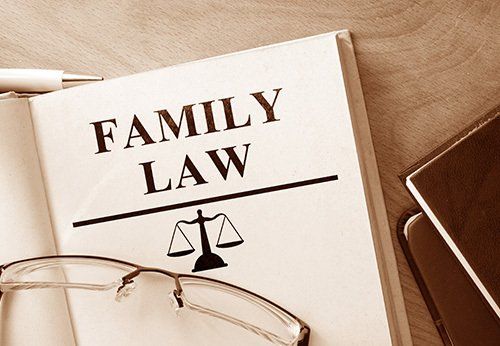 A book is open to a page that says `` family law ''.