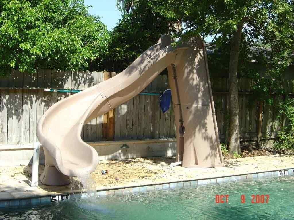 A picture of a slide in a pool was taken on oct 9 2007