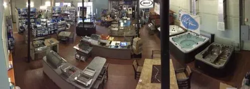 A large room filled with lots of furniture and hot tubs.
