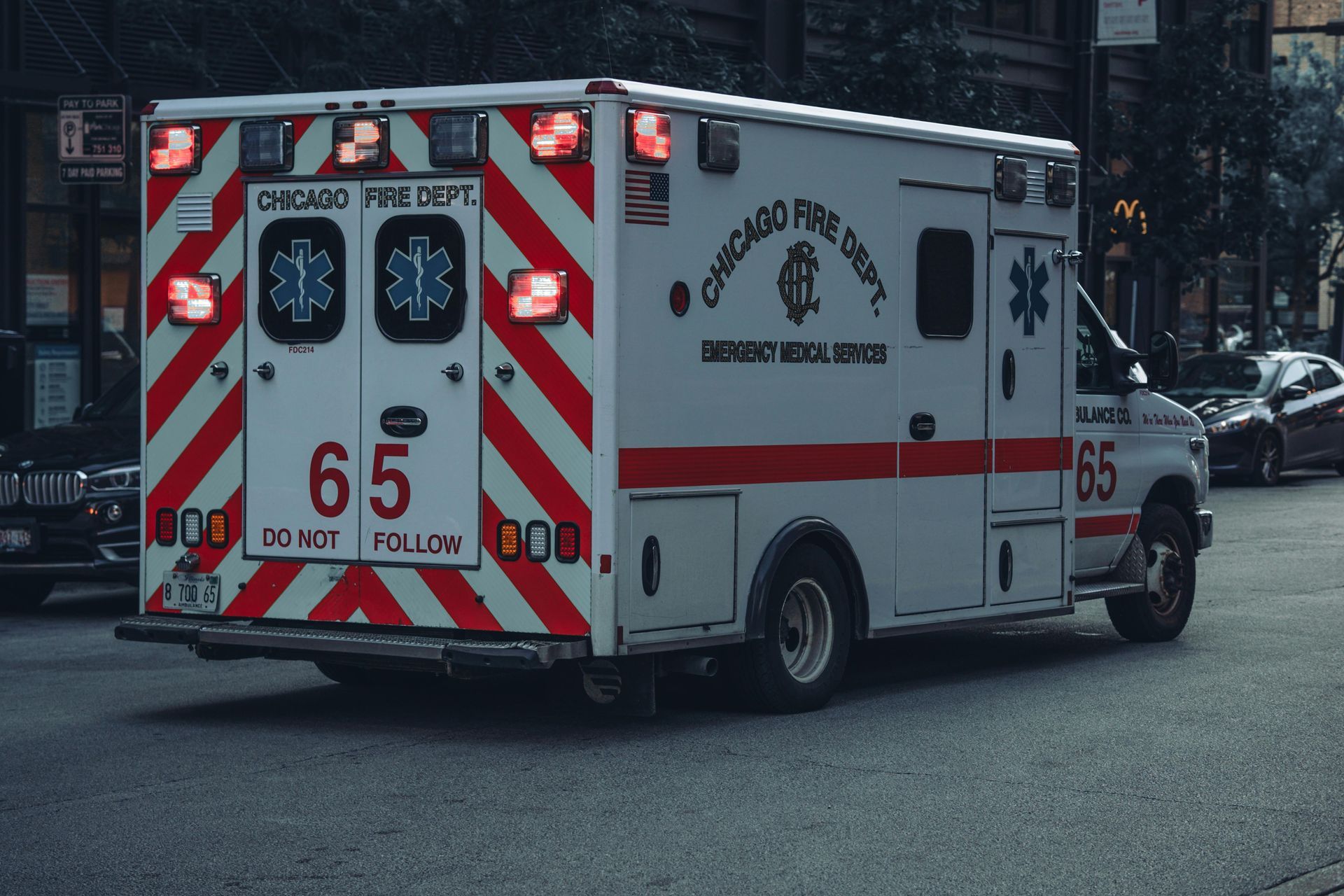 An ambulance is driving down a city street.