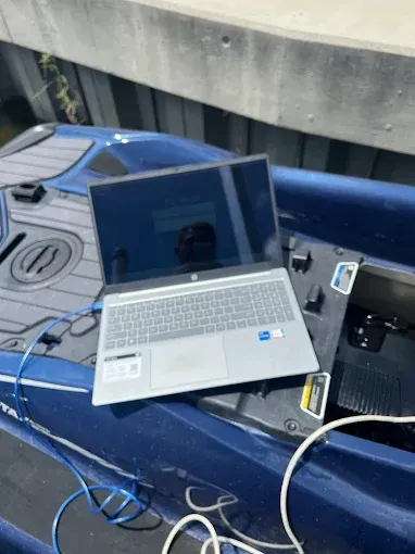 Laptop on a blue jet ski 