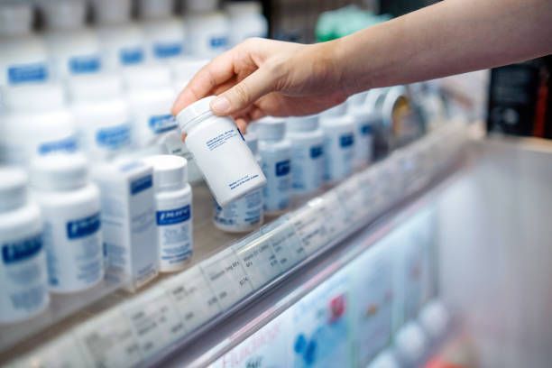 Woman's Hand Taking A Bottle Of Medicine | Little Rock, AR | TChase Healthcare Solutions