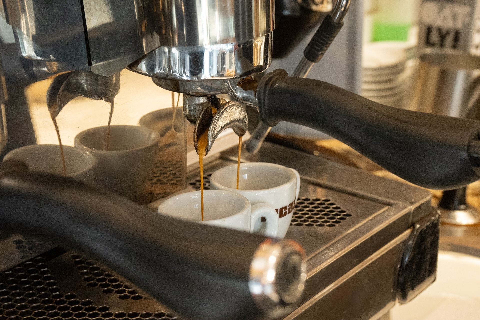 Espresso machine dispensing coffee into two white cups.Domenica
Home made italian pastries, food & coffee