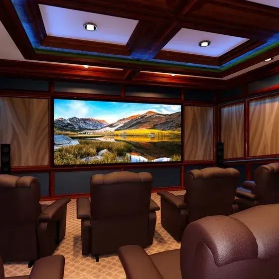 A home theater with a large screen on the wall