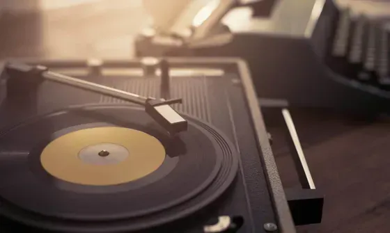 A record player is playing a record on a table.