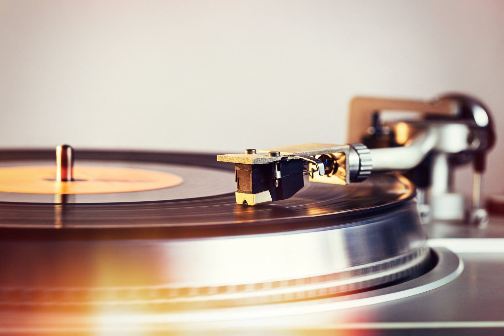 A close up of a record player playing a record.