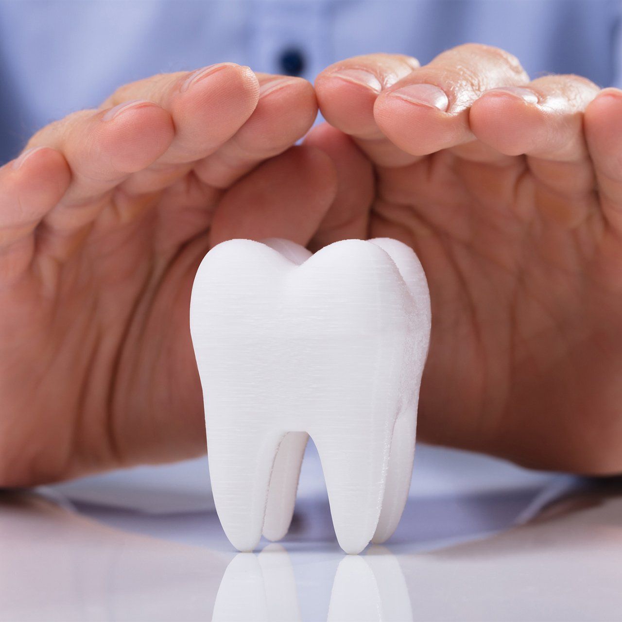Man's Hand Protecting White Tooth โ Frankfort, IL โ Brookside Dental Care Man's Hand Protecting White Tooth โ Frankfort, IL โ Brookside Dental Care