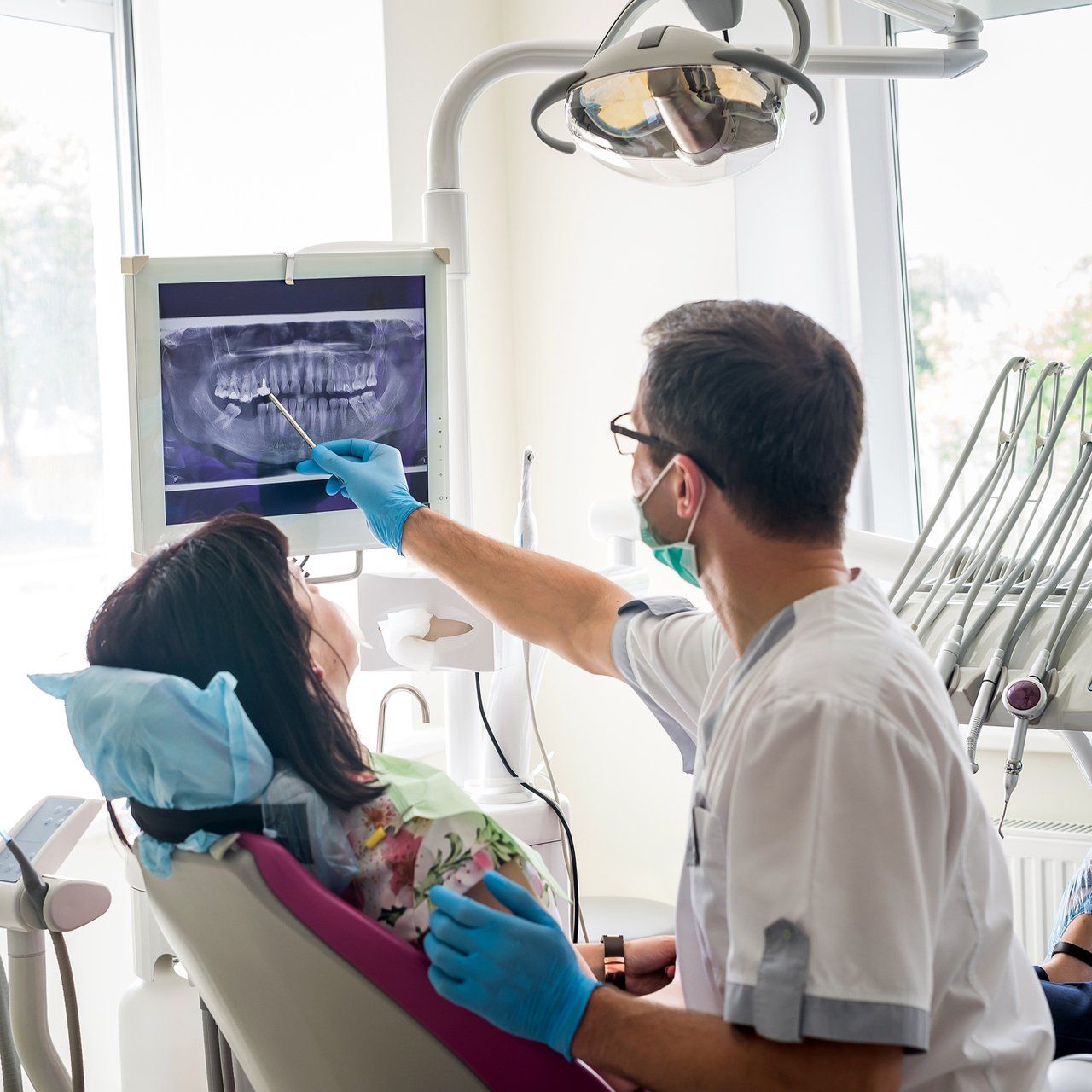 Dentist Showing Patient's Teeth Condition On Monitor — Frankfort, IL — Brookside Dental Care Dentist Showing Patient's Teeth Condition On Monitor — Frankfort, IL — Brookside Dental Care