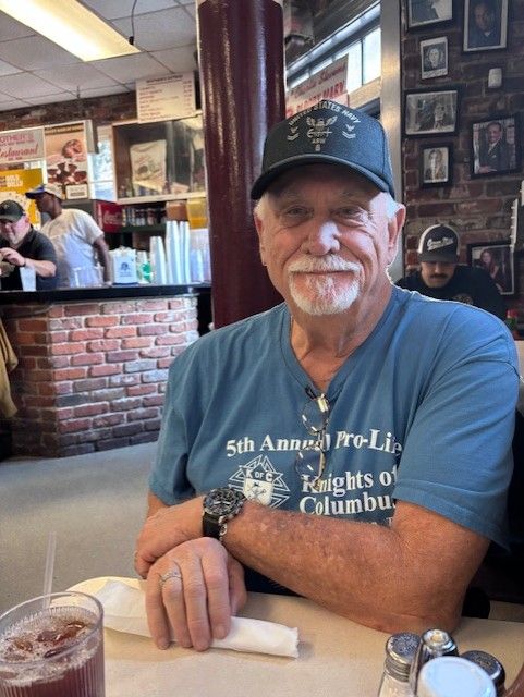 Man seated at a restaurant table