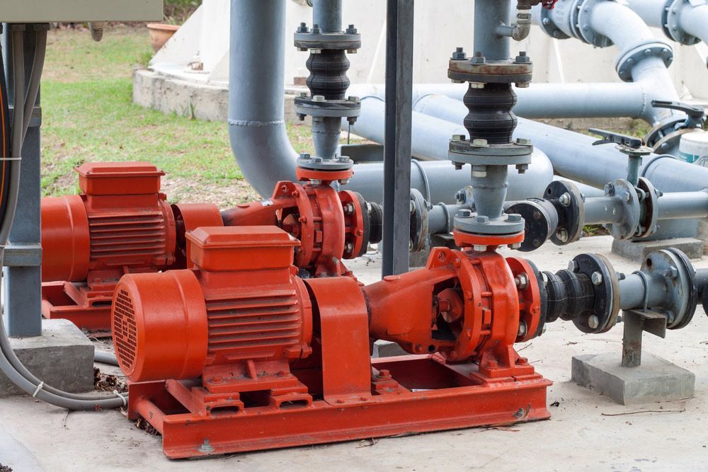 Red Motor Water Pump And Pipes — Water Equipment Service in Port Stephens, NSW