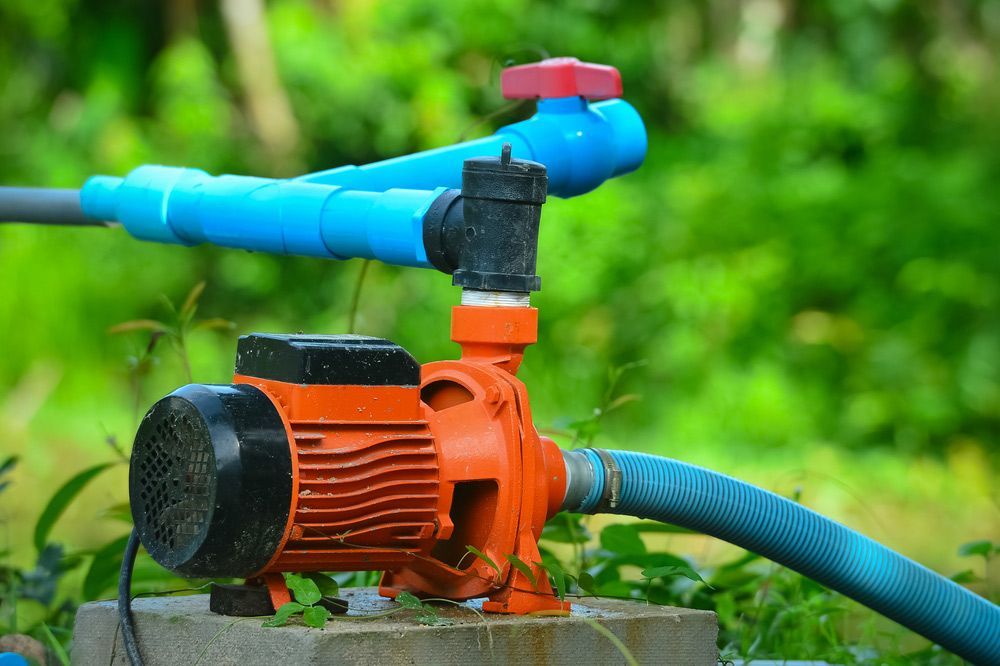 Orange Motor Water Pump — Water Equipment Service in Anna Bay, NSW