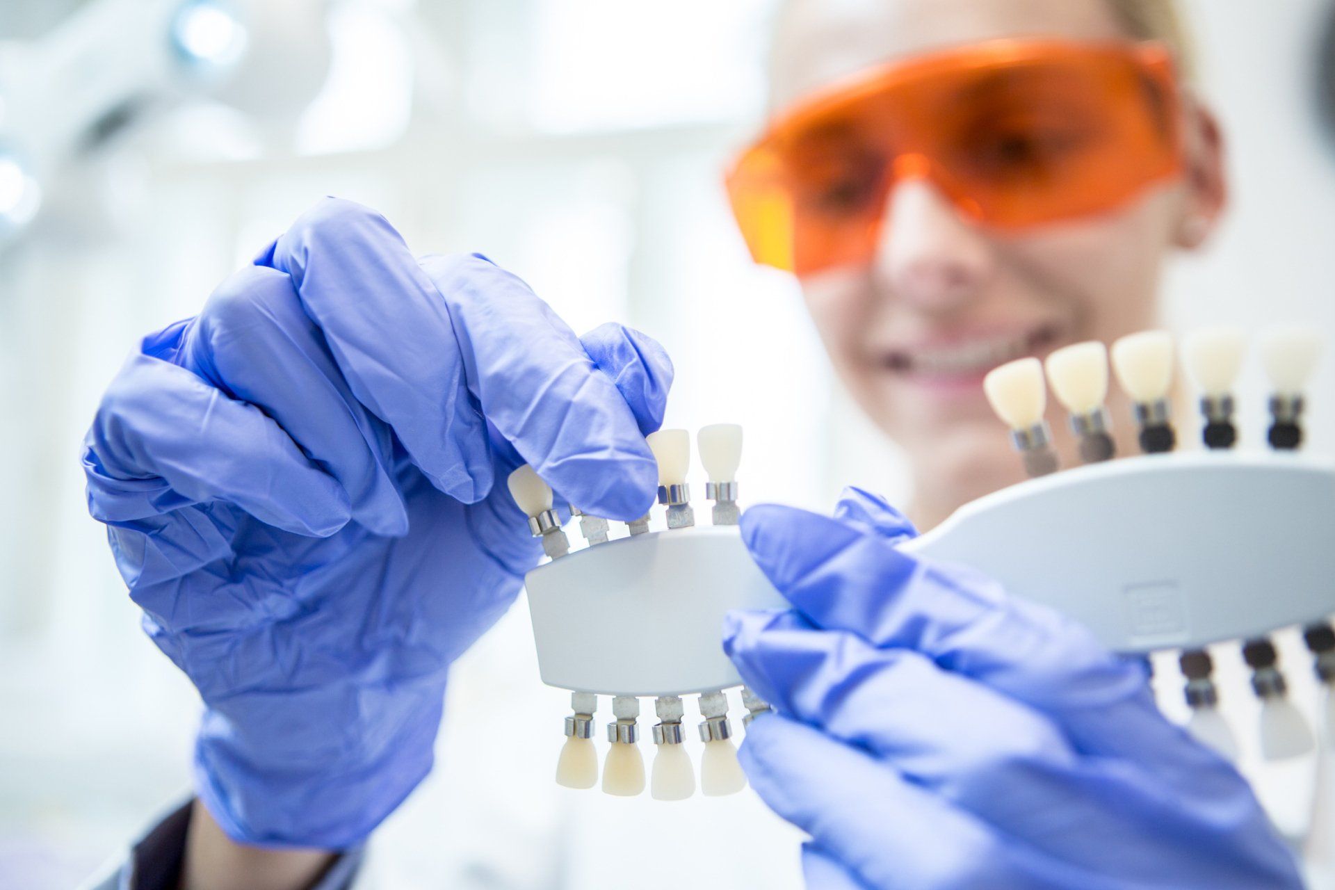 Dentist Holding Dental Crowns — Rhinelander, WI — Timber Drive Dental Inc
