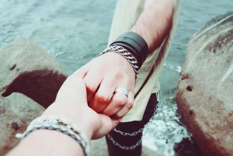 Couple holding hands indicating marriage and couples counseling services