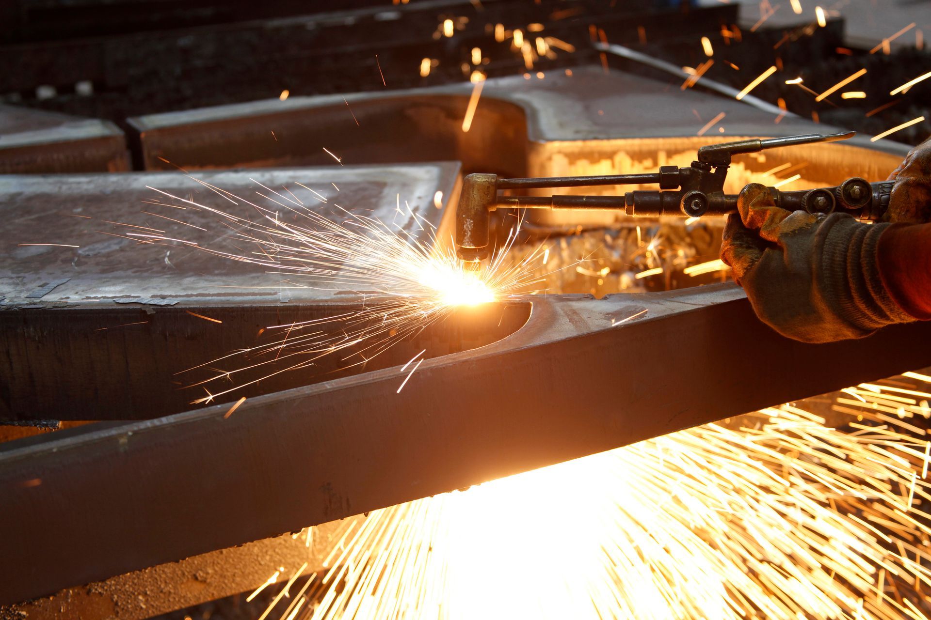 Steel factory welding process by skilled workers, highlighting a trusted steel supplier.