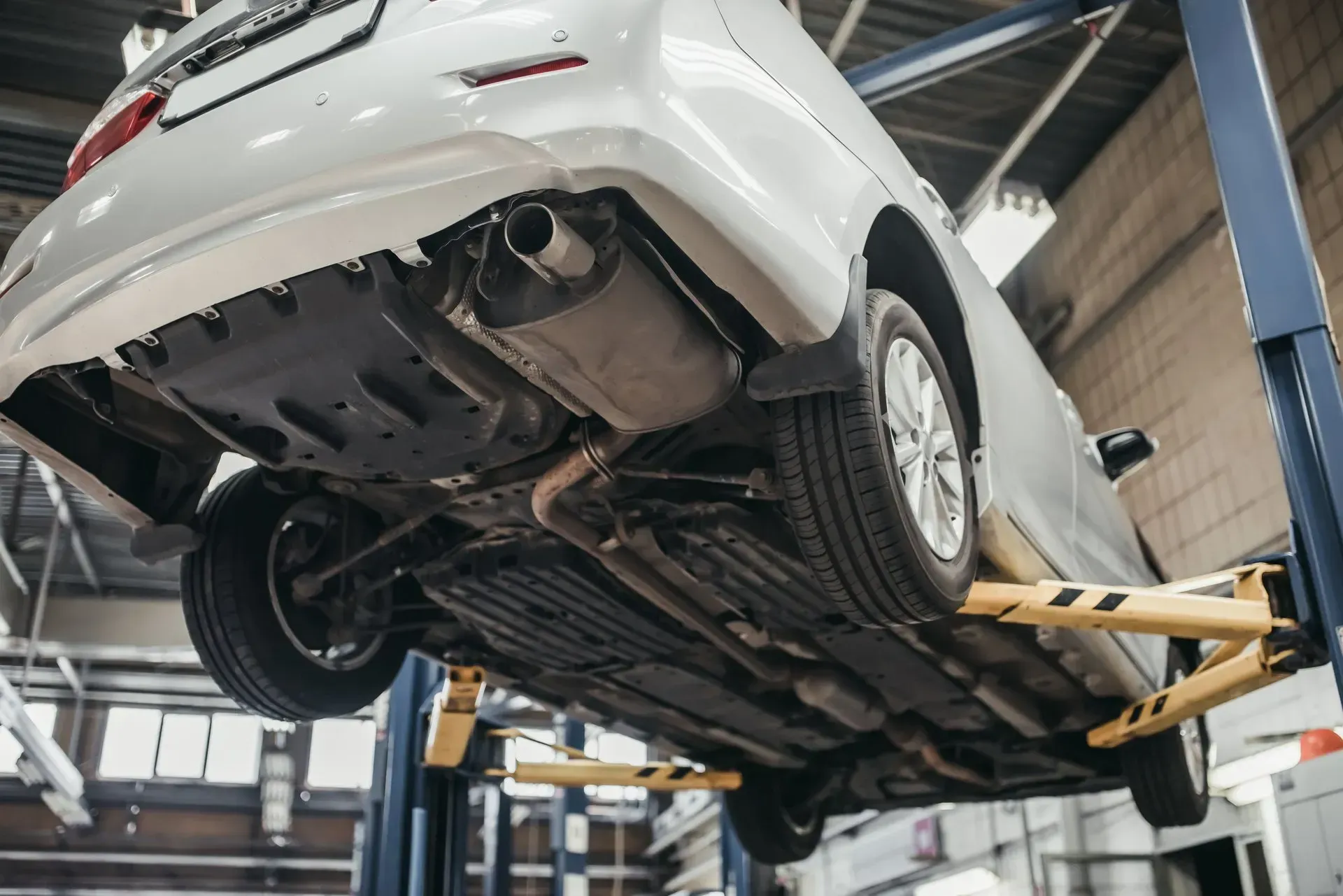 A vehicle undergoing catalytic converter maintenance in Escondido.