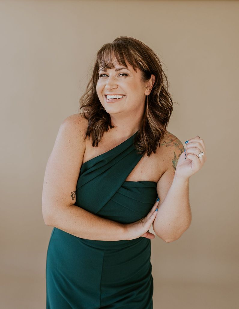 A woman smiling in a studio.