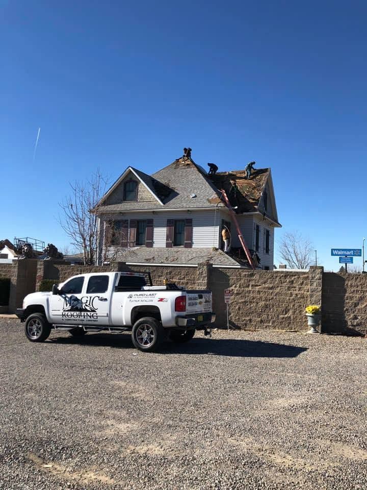 Magic Roofing crew completing a residential steep-slope roofing project