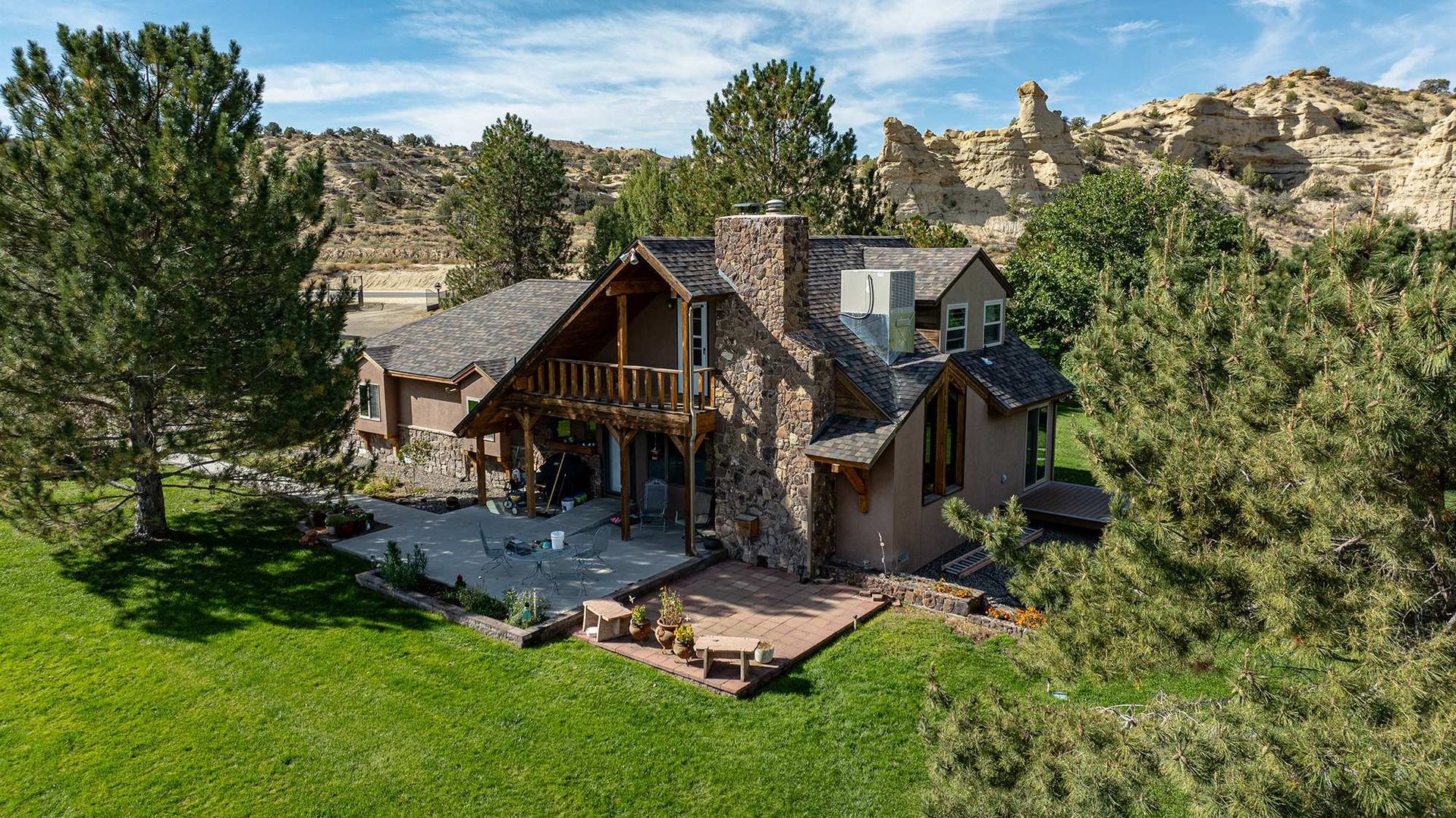 Custom Four Corners home with a completed architectural shingle roofing system