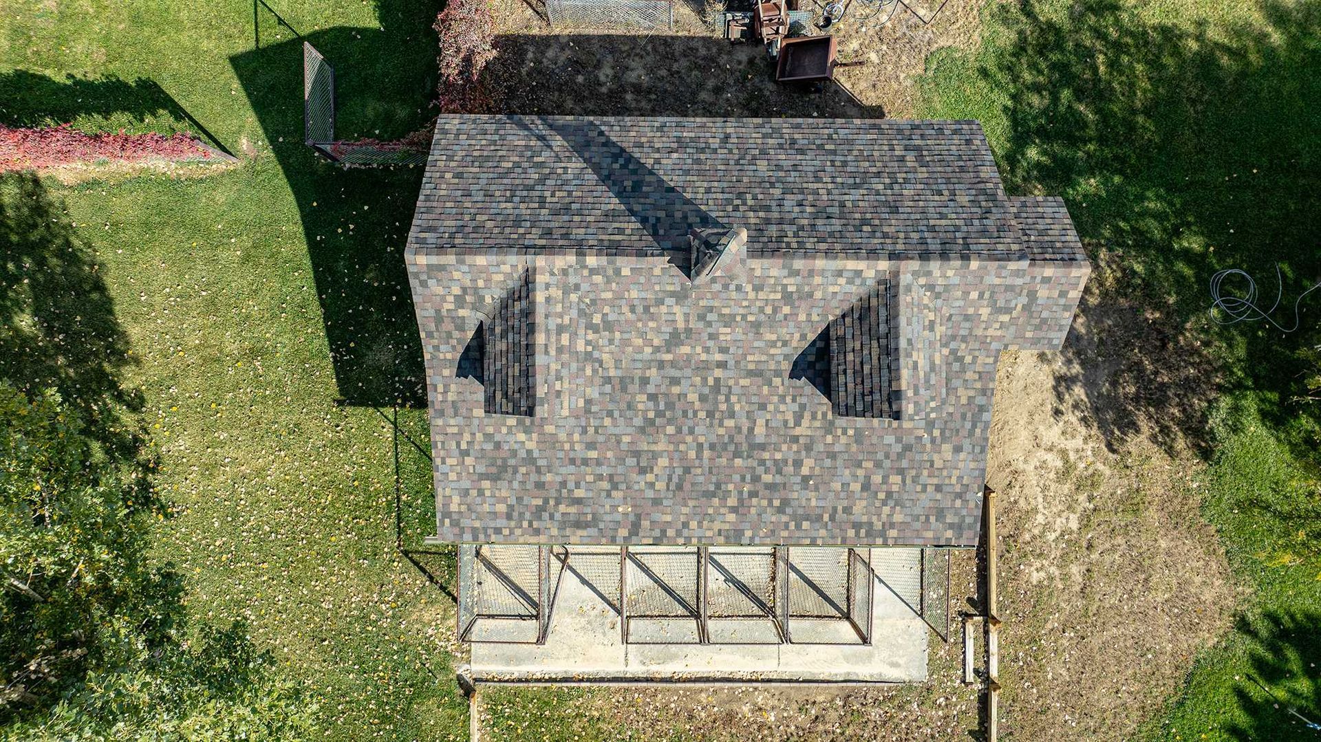 Overhead view of the completed architectural shingle roof on a custom home